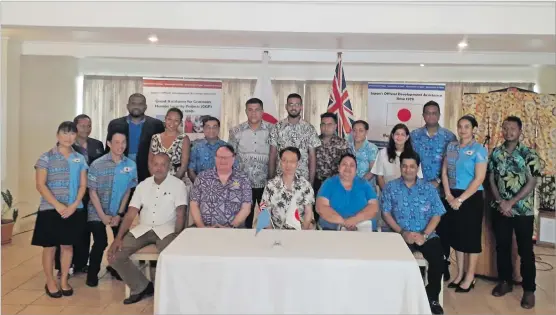  ?? Picture: ATELAITE RACIVA ?? Japanese ambassador to Fiji Kawakami Fumihiro (sitting 3rd from left), Japanese Embassy staff members, grant recipients and their delegation.