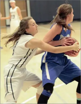  ??  ?? Gordon Lee’s Faith Alexander (left) ties up Trion’s Josie Maddox during Saturday’s four-point Lady Trojan win. (Messenger photo/Scott Herpst) Gordon Lee girls 46, Trion 42