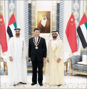  ?? Wam photos ?? Sheikh Mohammed bin Rashid and Sheikh Mohamed bin Zayed with Xi Jinping after presenting him with the Zayed Medal during a reception at the Presidenti­al Palace on Friday. —