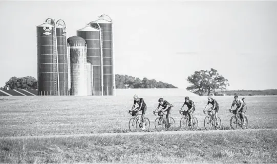  ??  ?? Bicyclists, including John Shackelfor­d, second from left, cycle through rural Georgia, visiting places associated with Black history as they ride from Mobile, Alabama, to Washington, D.C.