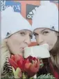  ??  ?? Kaillie Humphries, left, and Chelsea Valois drink beer Saturday after winning the women’s World Cup bobsled race in Germany.