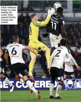  ?? ?? Elijah Adebayo heads in a late leveller for Luton Town against Derby County last month.