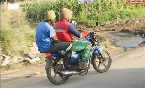  ?? Pic: Hilary Maradzika ?? These two men were captured riding a motorbike without protective gear along Simon Mazorodze Road in Harare recently