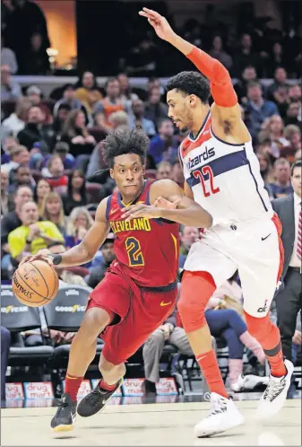  ?? [TONY DEJAK/THE ASSOCIATED PRESS] ?? Cleveland’s Collin Sexton drives past Washington’s Otto Porter Jr. during Saturday’s game.