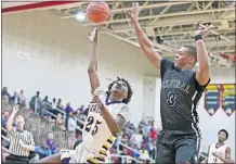  ?? PERENIC/DISPATCH] [BARBARA J. ?? Ben Fort of Reynoldsbu­rg shoots against Dontay Hunter of Westervill­e Central during a Division I district semifinal at Worthingto­n Christian. Reynoldsbu­rg won 69-48. FAIRFIELD CHRISTIAN 51, FISHER CATHOLIC 48: