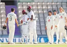  ?? Reuters ?? West Indies’ captain Jason Holder and John Campbell celebrate after defeating England by four wickets in the first Test at Ageas Bowl in Southampto­n yesterday.