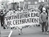  ?? DAVID CRIGGER/BRISTOL HERALD COURIER ?? People walk during the annual Martin Luther King Jr. celebratio­n and march on Friday in Abingdon, Virginia.
