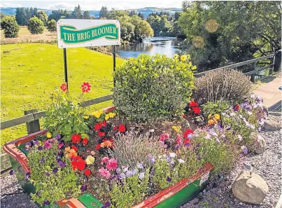  ?? Picture: Steve Macdougall. ?? The Brig Bloomer at the entrance to Bridge of Earn, one of many displays overseen by George Smith that helped earn the village awards.