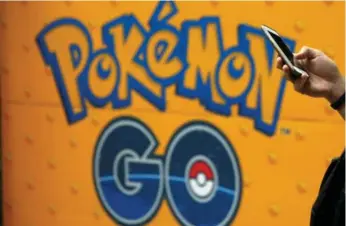  ?? KIM KYUNG-HOON/REUTERS ?? Pokemon Go Plus, a gadget that helps users detect nearby virtual pocket monsters, won’t be launched this week.