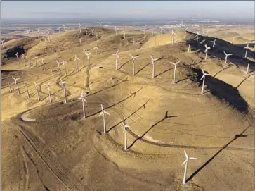  ?? Godofredo A. Vásquez Associated Press ?? THE PACKAGE of Democratic priorities will reduce emissions by about 40% by 2030, proponents say, with new incentives for climate-friendly energy such as the wind power from these turbines in Livermore, Calif.