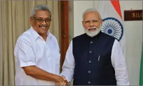  ?? REUTERS ?? Sri Lanka’s President Gotabaya Rajapaksa and Prime Minister Narendra Modi shake hands ahead of their meeting at Hyderabad House in New Delhi, on Friday.