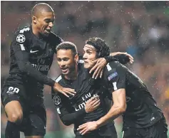  ?? — AFP photo ?? Paris Saint-Germain’s Neymar (centre) celebrates with Mbappe (left) and Cavani after scoring the opening goal of the UEFA Champions League Group B football match against Celtic at Celtic Park in Glasgow.