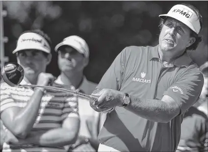  ?? JOHNNY CRAWFORD / JCRAWFORD@AJC.COM ?? Phil Mickelson watches from the ninth hole during Wednesday’s practice. He tied for second at the BMW Championsh­ip two weeks ago to move to fourth in the points stadings.