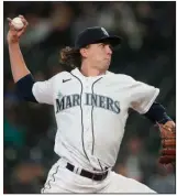  ?? (AP/Ted S. Warren) ?? Seattle Mariners right-hander Logan Gilbert is 4-0 with an American League-leading 0.64 ERA through Sunday’s games. The former Arkansas Traveler is also among the league leaders in strikeouts with 27. Gilbert and Miami Marlins righty Pablo Lopez, who leads the majors in ERA (0.39), earned the AL and NL Pitcher of the Month awards for April on Monday, respective­ly.