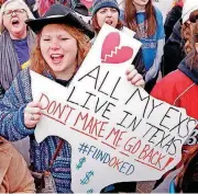  ?? [THE OKLAHOMAN ARCHIVES] ?? Kalee Morales, a Piedmont teacher, holds a sign April 2 at the state Capitol where teachers rallied for nearly two weeks seeking better pay and school funding.