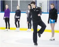  ?? DARREN BROWN/Ottawa Citizen ?? Olympic champion Scott Moir, right, goes through a drill with Ottawa figure skaters at the Nepean Sportsplex Wednesday.