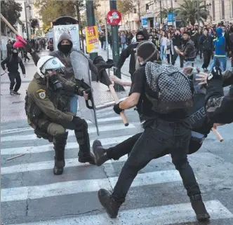  ?? Picture: AFP ?? Youths battle it out with police on the streets of the Greek capital