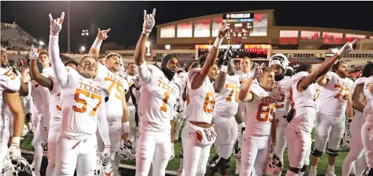  ?? BRAD TOLLEFSON/AP ?? Texas athletes, including football players, say they are done singing ‘‘The Eyes of Texas,’’ which first was performed by white singers in blackface.