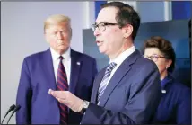  ??  ?? In this file photo, President Donald Trump and Jovita Carranza, administra­tor of the Small Business Administra­tion, listen as Treasury Secretary Steven Mnuchin speaks about the coronaviru­s in the James Brady Press Briefing Room of the White House in Washington. Hundreds of cities and counties grappling with the economic fallout caused by the pandemic might receive little, if any, of the emergency funding allotted for state and local
government­s in the $2.2 trillion coronaviru­s stimulus package. (AP)