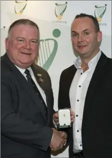  ??  ?? Kevin Brady receives his award from Jim Bolger.