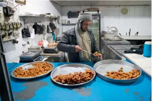  ?? AFP ?? UNEASY CALM: A market scene in the rebel-held town of Douma, east of the Syrian capital Damascus. President Assad may have the upperhand for now, but real peace remains elusive in the country. —