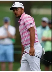  ?? (AP/Matt Slocum) ?? Xander Schauffele watches as his ball goes in for an eagle on the 15th hole during the third round of the Masters on Saturday in Augusta, Ga. Schauffele shot a third-round 68 and is in a four-way tie for second place entering today’s final round.
