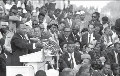  ?? Associated Press ?? The Rev. Martin Luther King Jr. speaks to hundreds of thousands during his “I Have a Dream” speech in front of the Lincoln Memorial for the March on Washington Aug. 28, 1963.