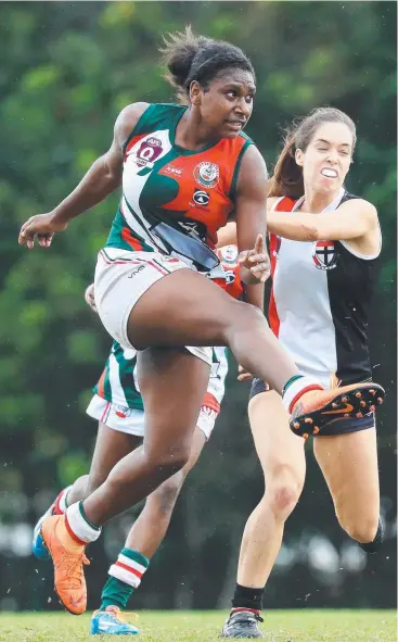  ?? Picture: JUSTIN BRIERTY ?? RELENTLESS: South Cairns midfielder Kitara Farrar gets a kick off during the AFL Cairns Women’s South Cairns and Cairns Saints game at Fretwell Park.