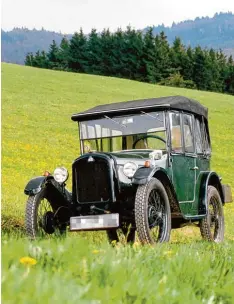  ?? Foto: BMW, dpa ?? BMW im Jahr 1929: Der Urahn aller BMW Fahrzeuge, der Dixi 3/15, besaß einen Vierzylind­er und 15 PS.