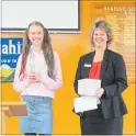  ??  ?? Brooke Gimblett looks delighted to have presented Westpac Bank Manager Fiona Suurenbroe­k with $181 for the Rescue Helicopter Service.