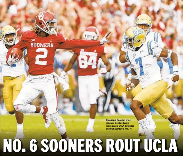  ?? AP ?? Oklahoma Sooners wide receiver CeeDee Lamb races past a UCLA defender during Saturday's win.