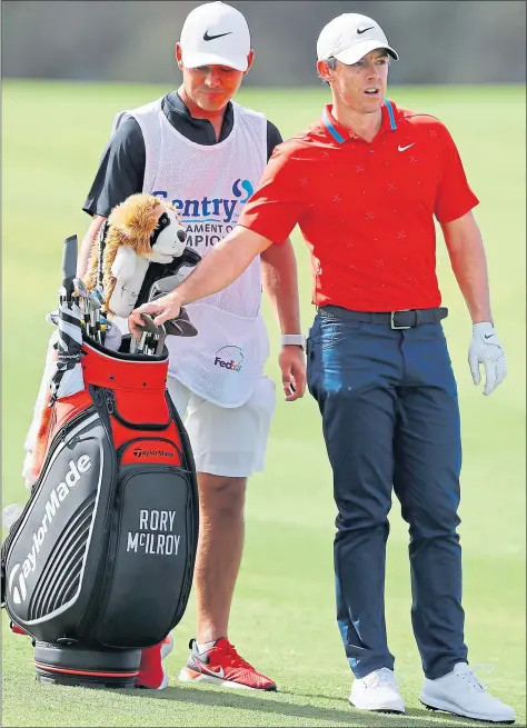  ??  ?? Northern Ireland’s Rory Mcilroy alongside caddie Harry Diamond at Kapalua