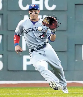  ?? MADDIE MEYER/GETTY IMAGES ?? Toronto Blue Jays’ outfielder Steve Pearce collects a single hit by Dustin Pedroia, of the Boston Red Sox, during the second inning at Fenway Park on Wednesday, in Boston, Mass.