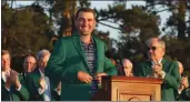  ?? ?? Scottie Scheffler celebrates after being awarded the Green Jacket after winning the Masters at Augusta National.