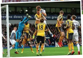  ?? EPA/AMA ?? HAPLESS Arsenal allowed Dawson to steal in unmarked and score at a corner, not once (left) but twice (above). It’s not as if they weren’t warned... West Brom are the top scorers from corners this season!