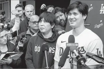  ?? Brian van der Brug Los Angeles Times ?? THE DODGERS, Major League Baseball and fans were rocked by allegation­s of sports betting and the theft of millions of Shohei Ohtani’s money by interprete­r and friend Ippei Mizuhara, left, who was fired last week.