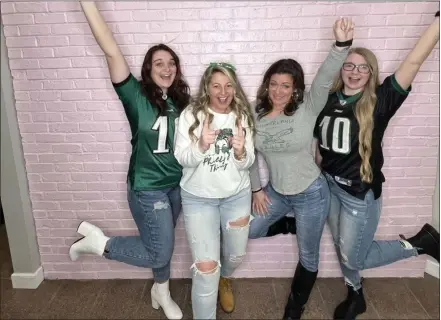  ?? COURTESY PHOTO OF BOMBSHELL STYLES ?? From left, Kamryn Justice, salon owner Aimee Ednie, Sherrie Kowalski and Taylor Meredith share their love for the Eagles at Bombshell Styles in Landenberg, London Britain Township.