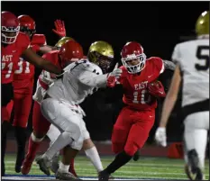  ?? ?? Denver East’s Sean Campbell runs in for a touchdown in the second half against Mullen at All-city Stadium on Friday night.