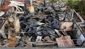  ?? PHOTO: QFES ?? GLENNON HOUSE: One wall was all that remained of the Ruthven St building after fire reduced it to rubble on Friday, January 6.