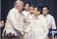  ?? ANDREW HARNIK/ASSOCIATED PRESS ?? President Donald Trump shakes hands with Philippine President Rodrigo Duterte at an ASEAN Summit dinner in Manila, Philippine­s, on Sunday.