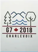  ?? —AFP ?? OTTAWA: The G7 summit logo is shown on a wall of a government building in Ottawa.