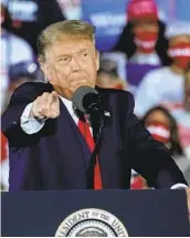  ?? JOHN BAZEMORE AP ?? President Donald Trump speaks during a rally Friday at Middle Georgia Regional Airport in Macon, Ga.