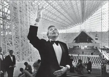  ?? Tony Barnard Los Angeles Times ?? ROBERT SCHULLER, in his new Crystal Cathedral in 1980, built one of the nation’s first megachurch­es.