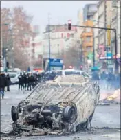  ?? AFP ?? A car burns outside the Lycee Profession­nel Jean-Pierre Timbaud high school after being set ablaze by protesters on Monday.