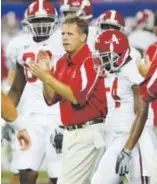  ??  ?? JimMcElwai­n was the offensive coordinato­r on two national title teams at Alabama.