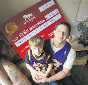  ?? Gary Kazanjian
For The Times ?? DAVID MOYA, with his son Aaron at their home in Oakdale, Calif., hit the jackpot for his half-court shot at Sunday’s game at Staples Center. “There’s always a chance at anything in life, right?” he said.