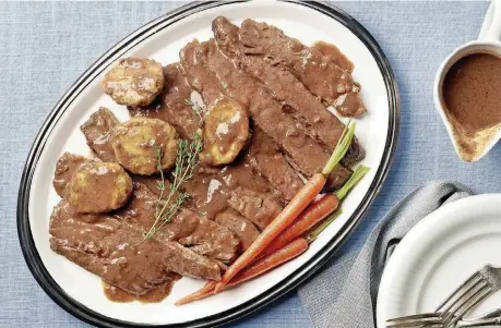  ?? [PHOTO BY RENEE COMET, FOR THE WASHINGTON POST] ?? Red Wine-Braised Brisket With Aunt Rifka’s Flying Disks