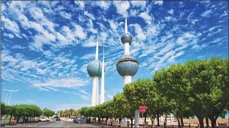  ??  ?? The Kuwait Towers soaring under a sky filled with clouds. (Mohammad Alhadhood – KUNA)