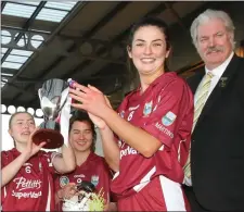  ??  ?? Katie O’Connor, the St. Martin’s captain, after receiving the cup.