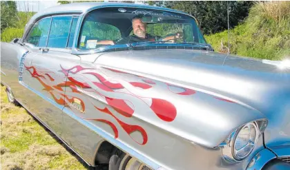  ?? ?? Pukehina’s Stu Brickland behind the wheel of his 1956 Cadillac Sedan de Ville he will be driving to Beach Hop.